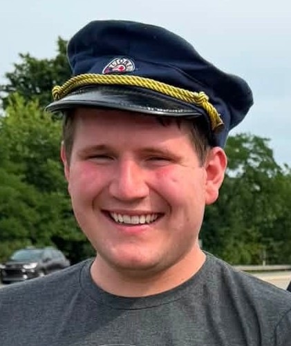 Bradley wearing a train conductor’s hat